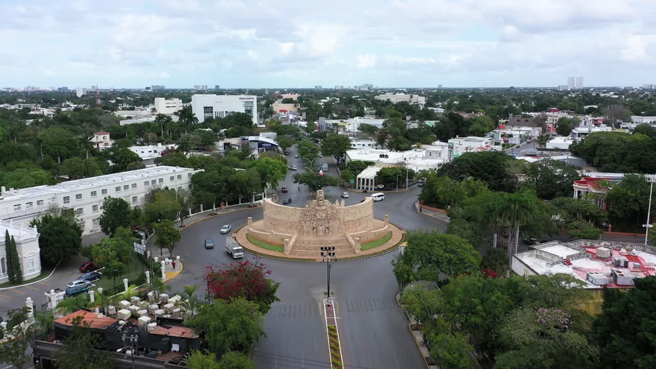 Aerial push in to the Monument a la Patria, Homeland Monument on the Paseo de Montejo in Merida, Yucatan, Mexico
