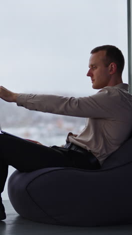 confident succesfull businessman with phone. professional business manager working in modern office. vertical video