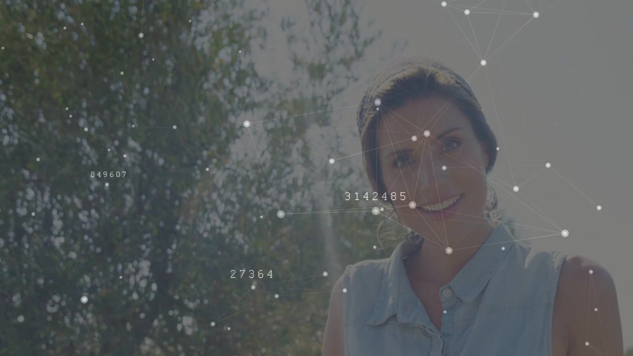 Animated tech overlay sweeping across face initiating woman lifting head and smiling in sunny park