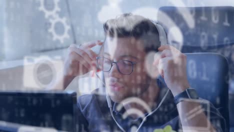 Animation-of-Caucasian-man-putting-headphones-on-over-data-processing