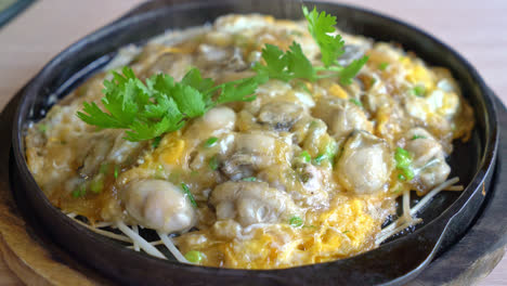 oyster omelette with bean sprout on hot pan - asian food style