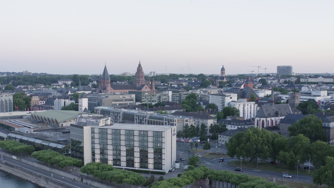 Aerial lifting Drone View of Mainz dom, Rheingoldhalle and Cityscape at Sunset Germany 4k