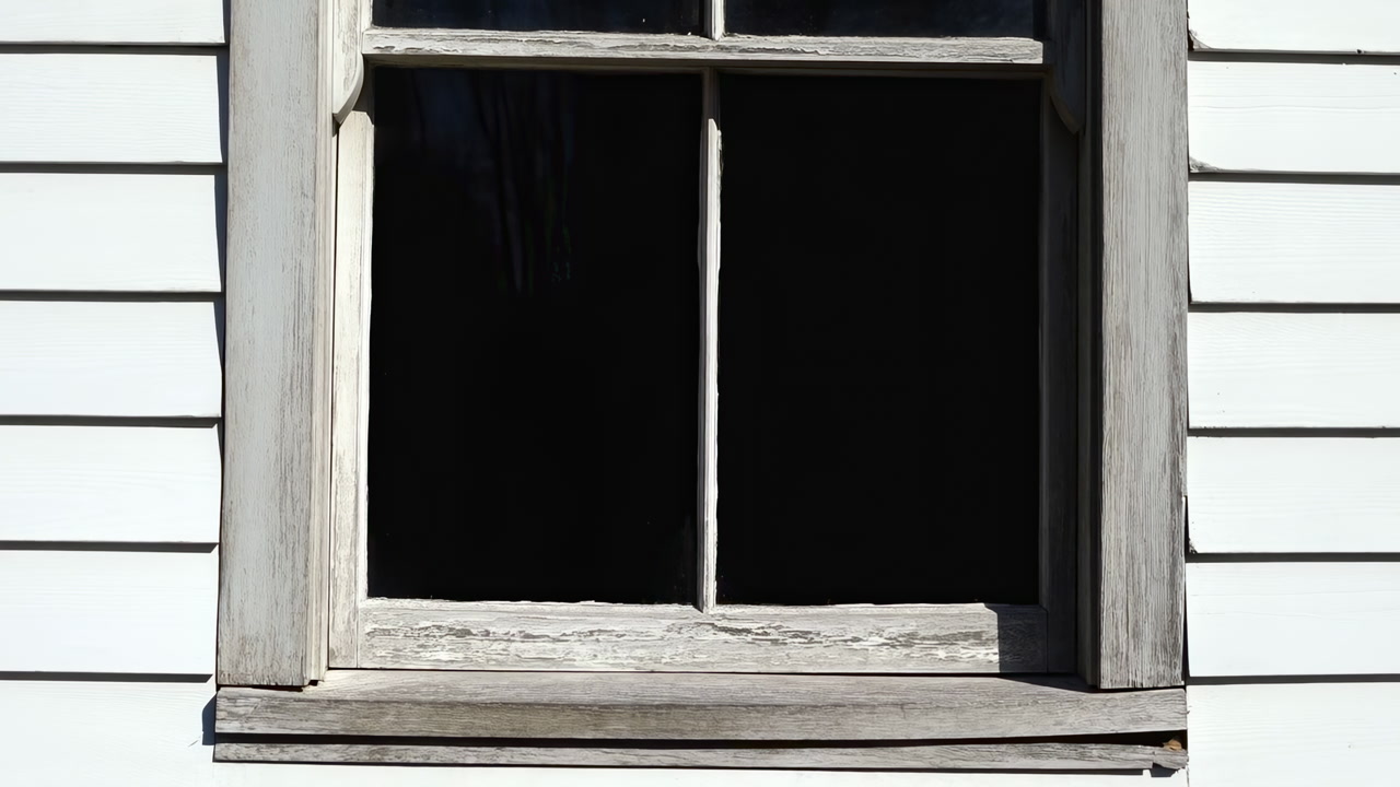 Old Wooden Window On White Siding Dark Empty Interior, Cracked Paint And Worn Frame, Sunlit Clapboard