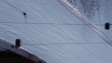 there are winter sports that play the role of the winter olympics in cortina and milano italy. learning how to ski and snowboard i capture these videos with my drone that