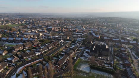 Drone's-eye-winter-view-captures-Dewsbury-Moore-Council-estate's-typical-UK-urban-council-owned-housing-development-with-red-brick-terraced-homes-and-the-industrial-Yorkshire