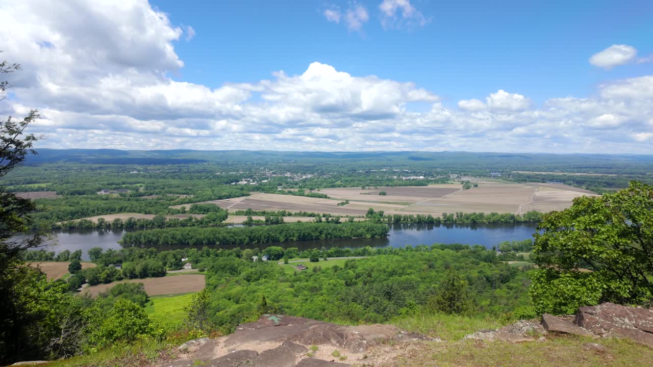 Aerial establishing shot over Northampton and Connecticut River, summer view