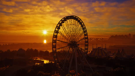 a ferris wheel at sunset