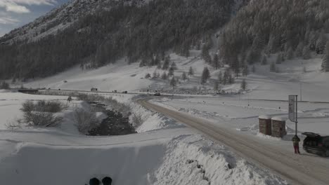 Stunning-Livigno-Alps-drone-video:-snow-peaks,-city-and-mountain-town,-ideal-for-high-quality-winter-and-tourism-ads