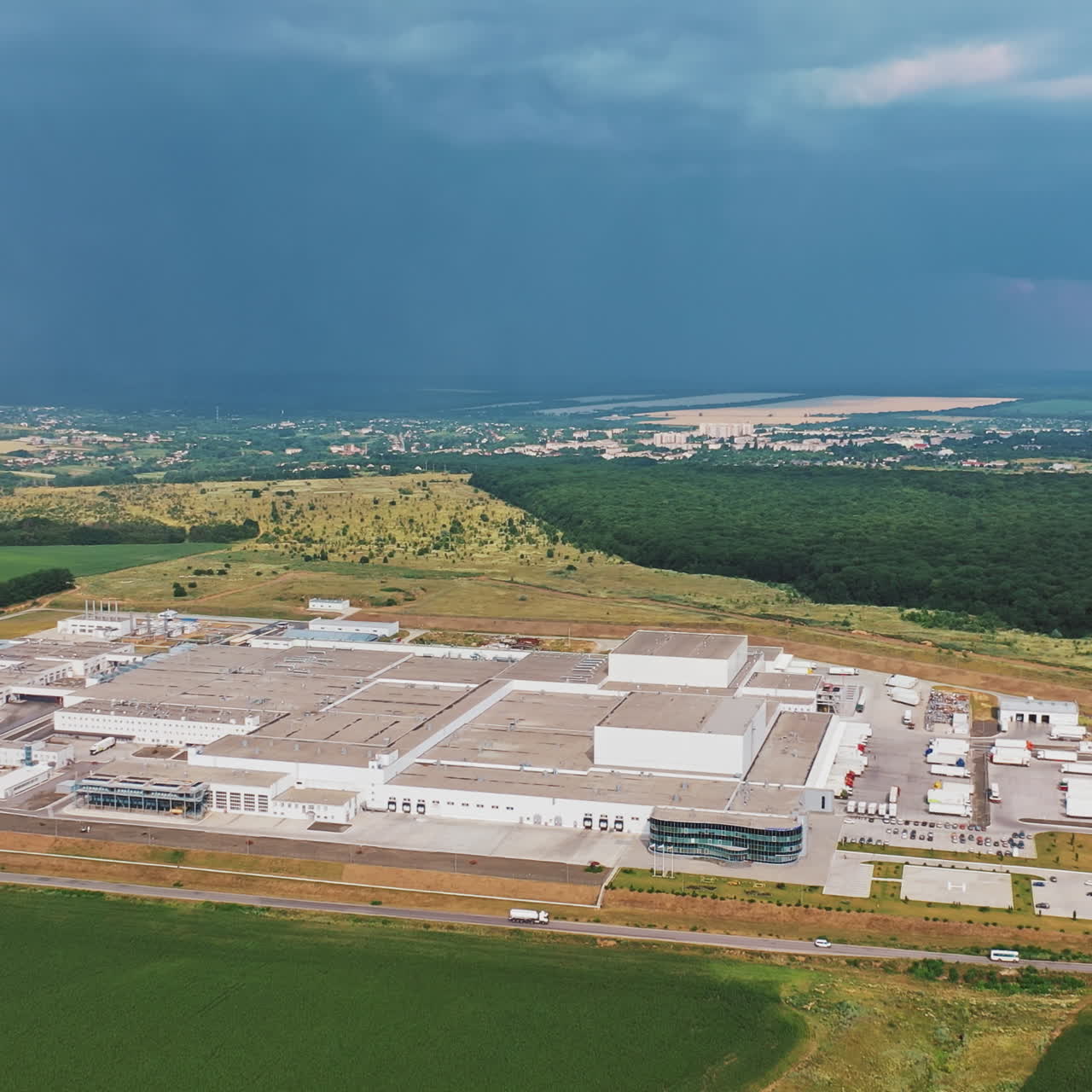 the exterior of a large modern production plant or factory. Aerial view