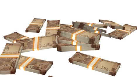 many wads of money falling on table. 10 indian rupees banknotes.