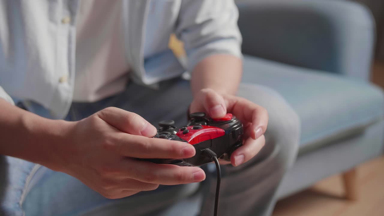 Hand'S Man Holding Joystick While Playing Game At Home