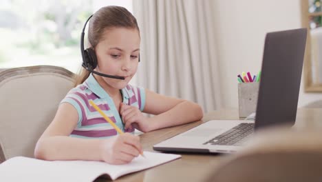 Happy-caucasian-girl-having-video-call-on-laptop