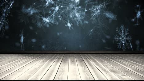 animation of snowflakes falling over wooden surface and blue background