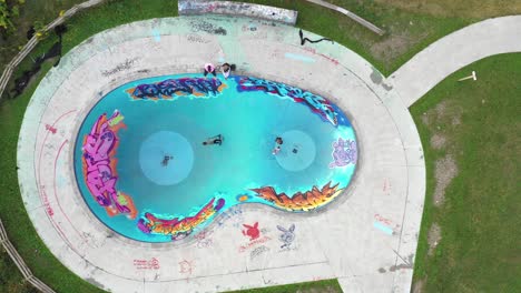 skatepark bowl above rising view with youth having fun