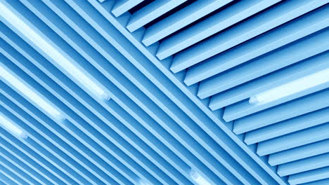 decorative panels on the ceiling with long led lamps. switched on illumination of white light. low angle view.