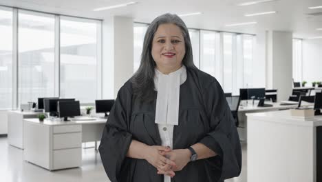 happy indian senior female lawyer smiling to the camera