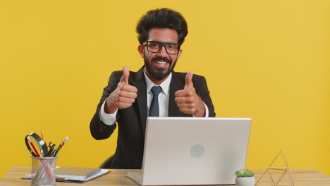 Happy-business-man-looking-approvingly-at-camera-showing-thumbs-up,-like-positive-sign,-good-news