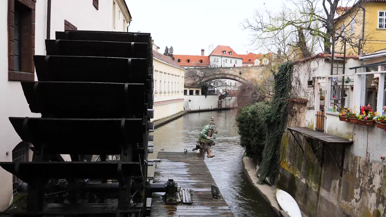 Houses along the Devil&acute;s Stream and the Wooden wheel of Grand Priory Mill Prague, Czech Republic