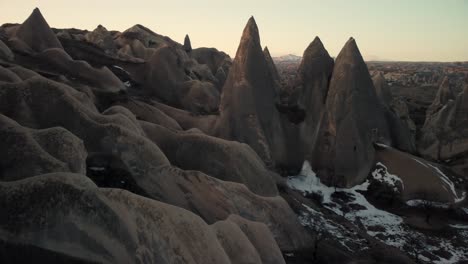 aerial view of fairy chimneys at goreme, cappadocia, turkey at sunrise