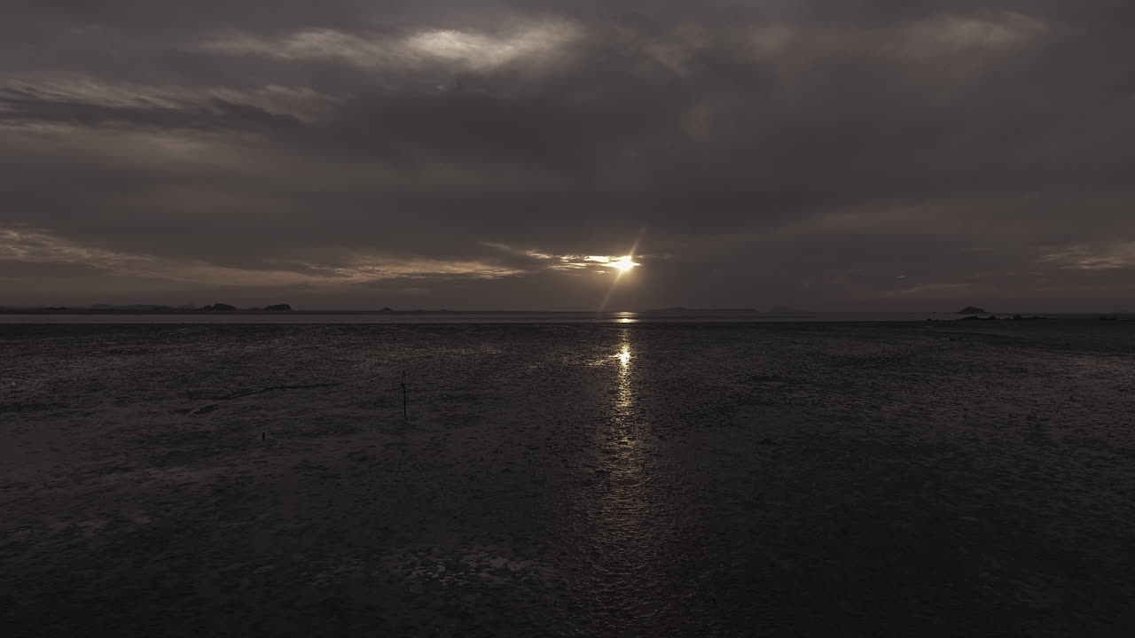 Scenery of low tide at sunset, drone shot, low flying shot