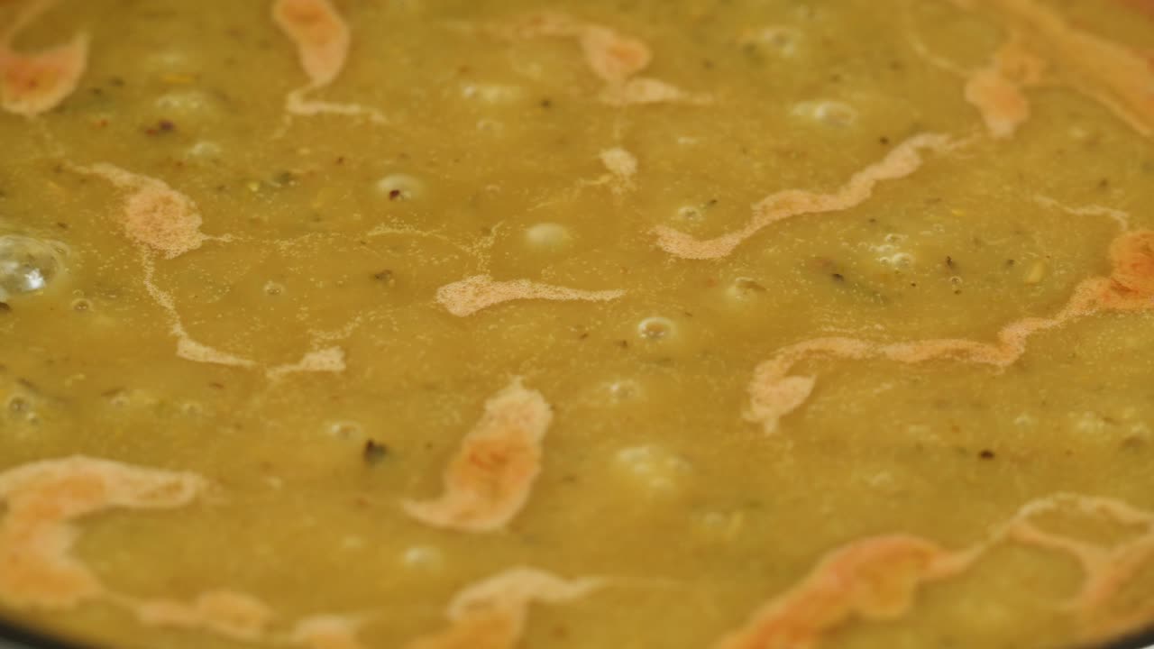 A vibrant platter featuring a variety of traditional Indian dishes, including curries, chutneys, and flatbreads.