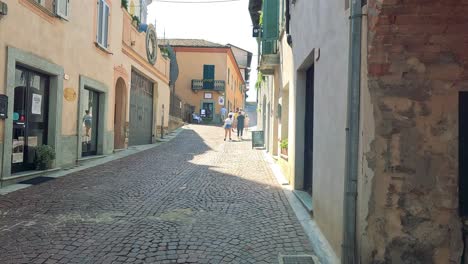 exploring a picturesque street in cuneo, italy