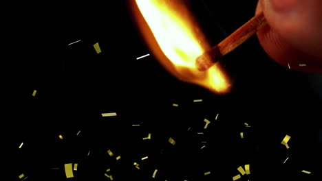 burning matchstick with yellow confetti falling animation on black background