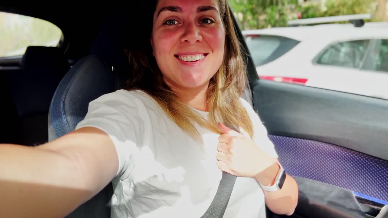 Joyful Female Vlogger in Vehicle Recording Content