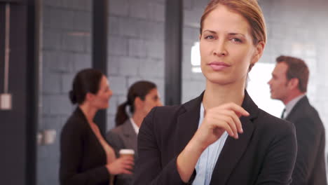 Smiling-businesswoman-posing-for-camera