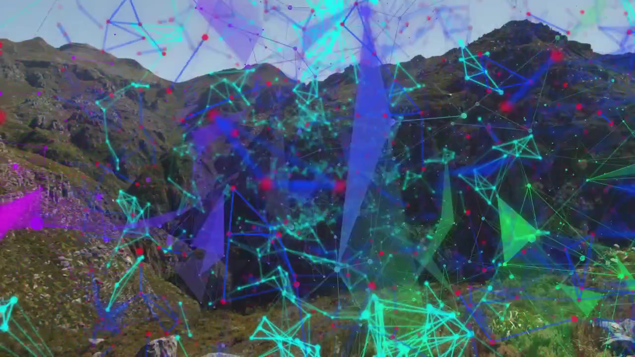 Cyan network appearing lower center expanding across rocky ridge shards sweeping showing data links