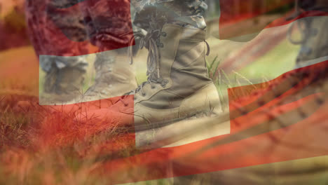 Animation-of-flag-of-switzerland-waving-over-soldiers-boots