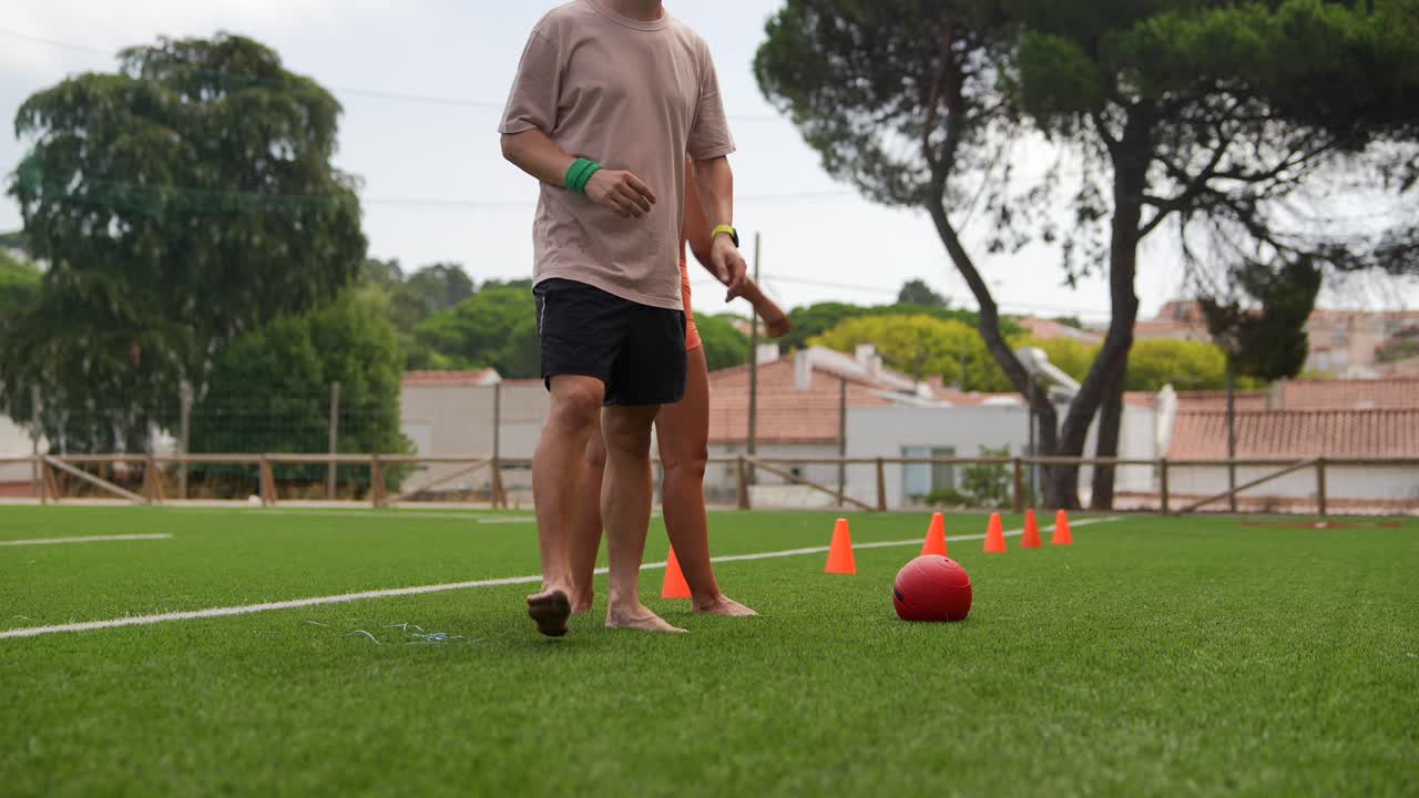 People Exercising on Football Field