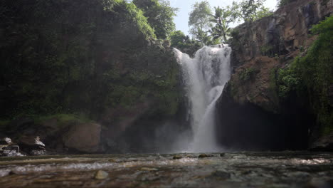 Waterfall-cascades-into-pool-below-creating-picturesque-scene