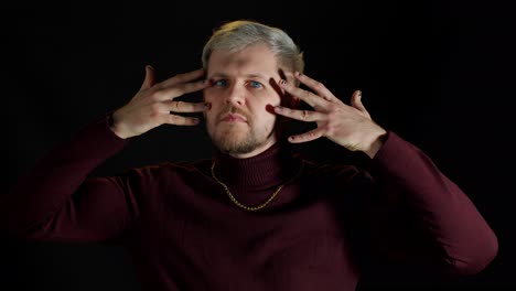 stylish young man with blue eyes looking at camera, posing, feeling happiness, fun, enjoyment