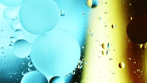 real abstract colourful oil drops in water rotation with color gradient mixing background