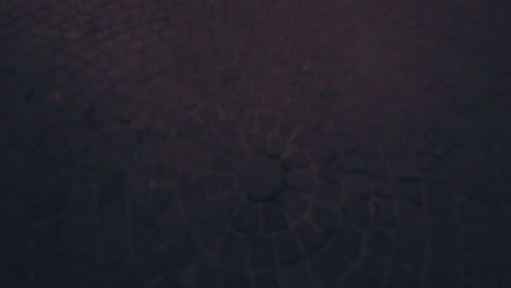 Tilt-up-revealing-a-wooden-door-with-ironwork-and-granite-frame-on-cobblestone-street-in-the-center-of-San-Miguel-de-Allende