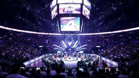 an electrifying celebration: enthusiastic audience engaging in a thrilling live event with stunning visuals and high energy in a packed arena