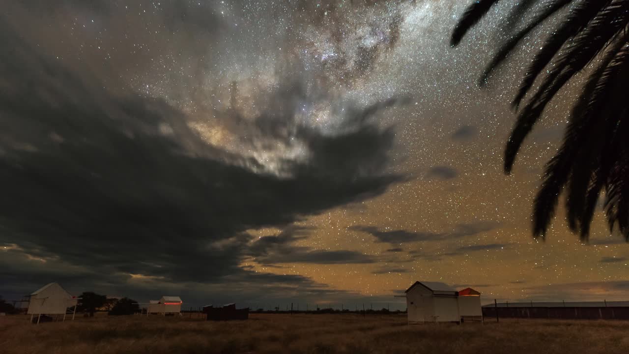 Milky Way timelapse with clouds over the astrophotography astro farm in Namibia with beautiful view of the Galaxy.