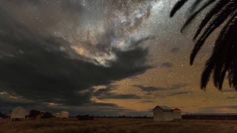 milky way timelapse with clouds over the astrophotography astro farm in namibia with beautiful view of the galaxy.