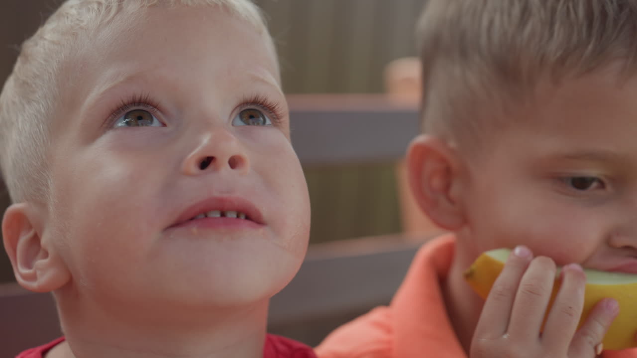 Child Displays Goofy Expression With Melon Juice, Young Child Showing Humorous Face With Juice Dripping Nearby, Child Pretending To Be Silly While Holding Melon Juice And Making Funny Face