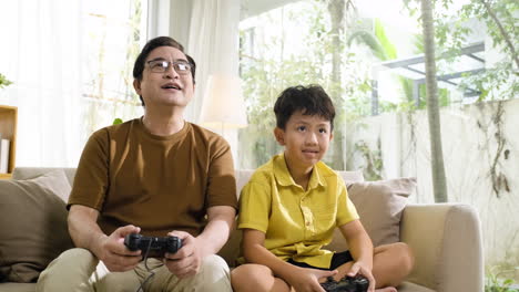 Asian-man-and-boy-in-the-living-room