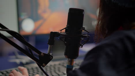 Close-up-of-pro-streamer-woman-talking-at-microphone