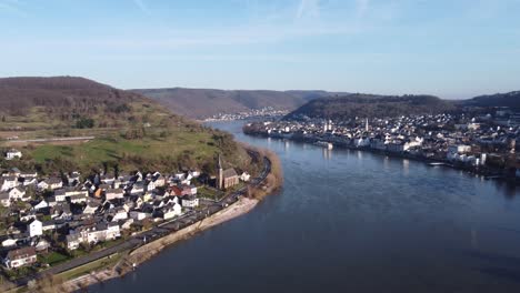 flying backwards over rhine valley facing boppard and filsen town, germany