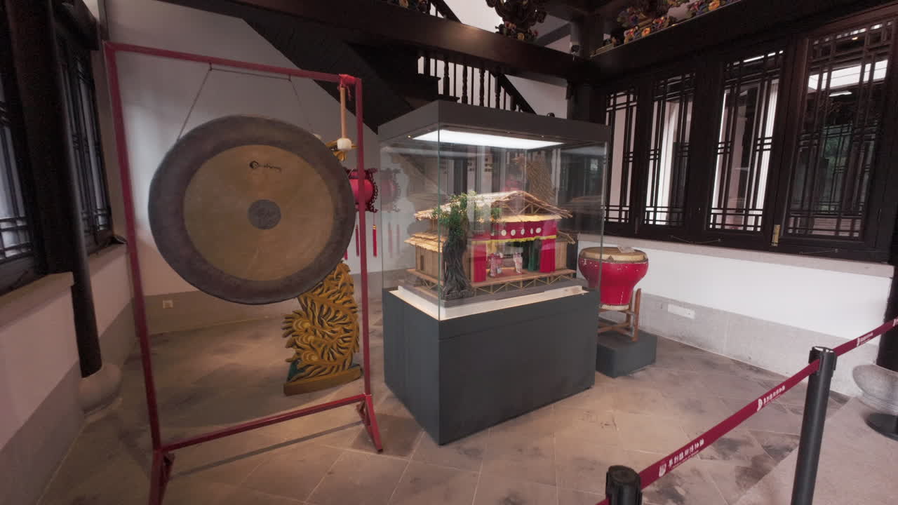 Exposition model of an old Chinese Opera theatre with huge Gong drum in the exhibition hall at Chinese Opera centre in Guangzhou, China