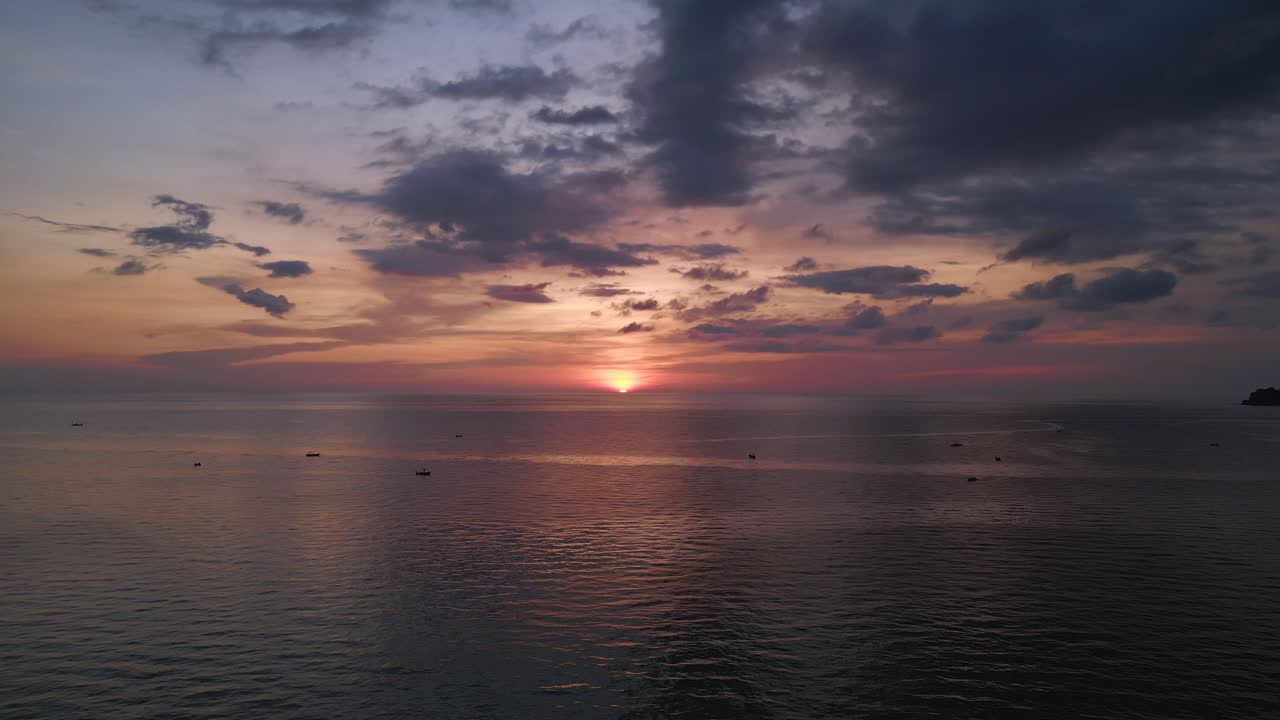Sunset on sea beach, orange clouds colorful