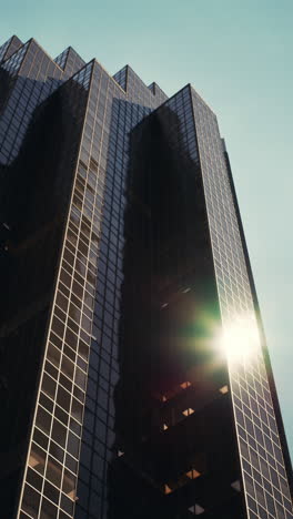 a tall skyscraper reflecting the sun