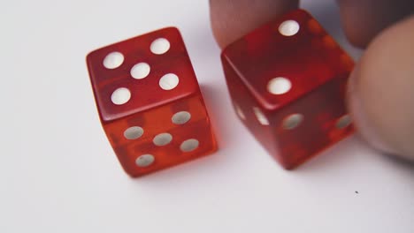 throwing elegant dices with white spots on light surface