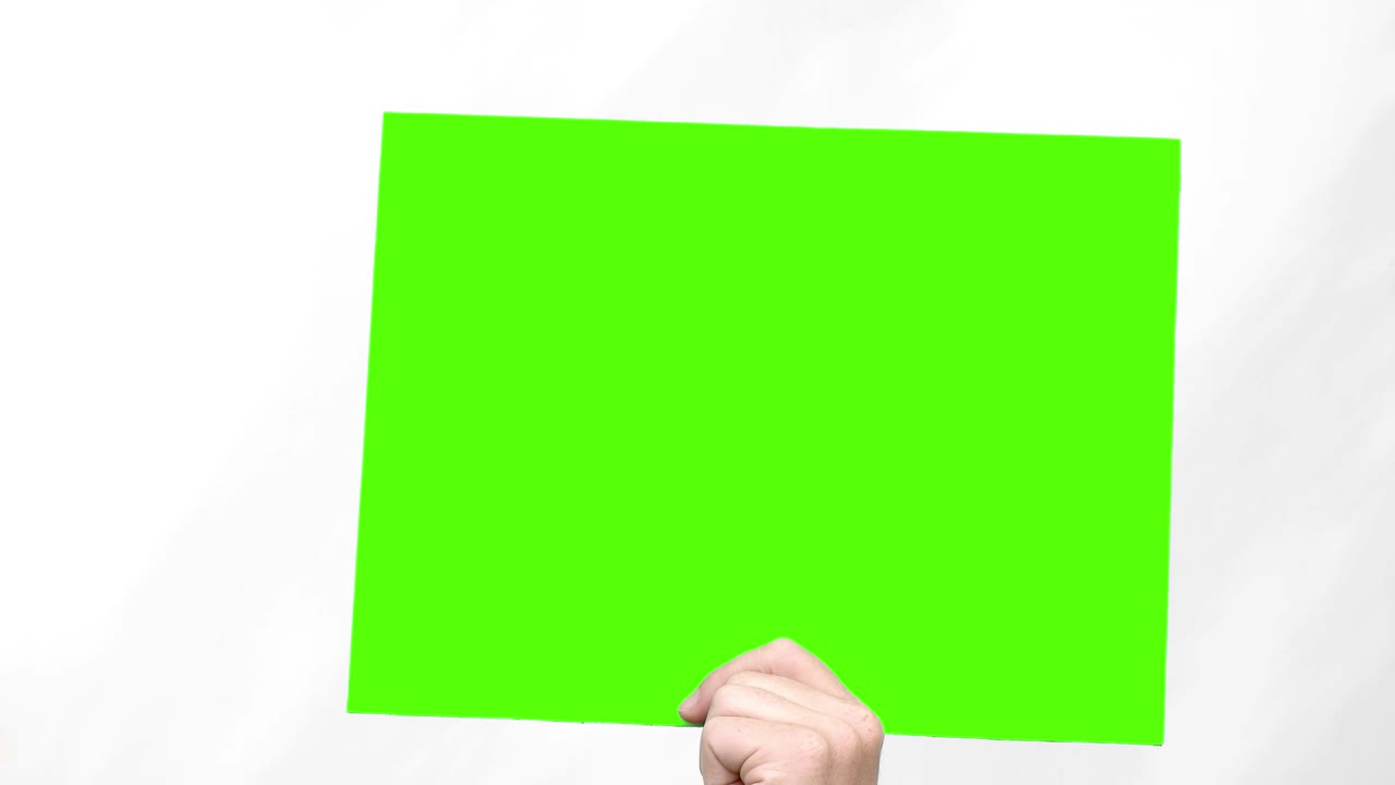 인간의 손은 아래의 녹색 화면을 보여줍니다. 루프 비디오