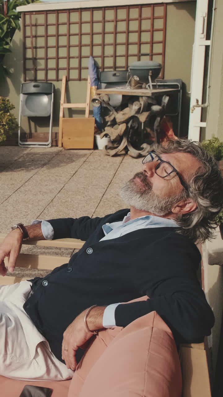 Man Relaxing Outdoors in a Garden