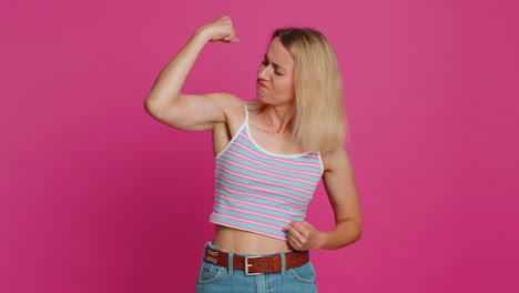 woman looking confident showing biceps, feeling power strength to fight for rights, success win